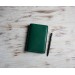 Green leather field notes cover 